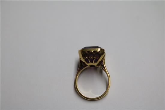 An 18ct gold and amethyst set dress ring, size M.